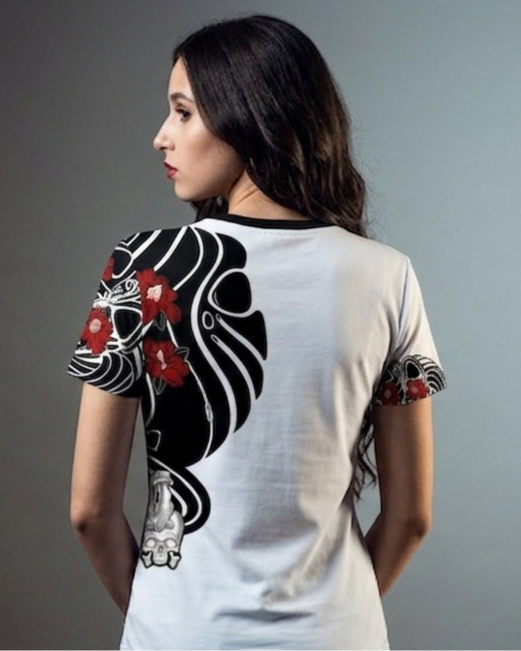 A woman shown from the back wearing a white t-shirt with a large black and red Japanese-style graphic print on the back and sleeves.