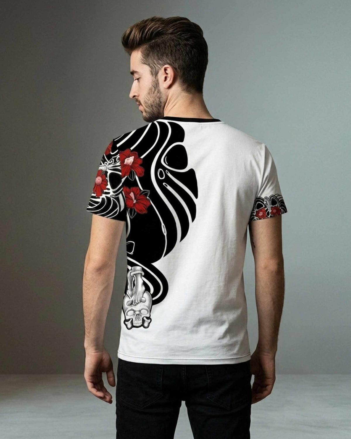 Back view of a male model wearing a white ROCKEN T-shirt featuring the Asian Scratch artwork with black ornamental elements, red flowers, and a skull detail.