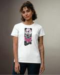 A woman modeling a white short-sleeve crewneck t-shirt with a black and pink graphic print on the front, paired with dark blue jeans, set against a neutral gray studio background.