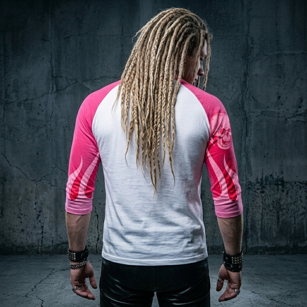 Back view of a man wearing a white and pink three-quarter sleeve raglan shirt featuring pink flame graphics and additional artwork on the sleeves.